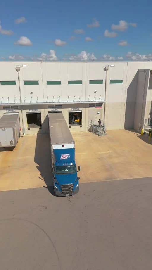 Truck and receiving area at AI Distribution's Palmetto warehouse, photographed from our actual facility tour